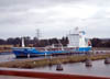 Ship alongside small port in the canal